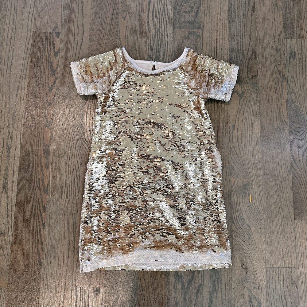 Peek— gold flip sequin holiday party dress.